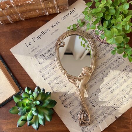 Miroir "face à main" en bronze